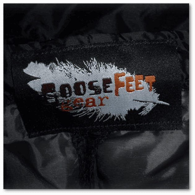 A close up of the Goosefeet Gear logo on a black down jacket